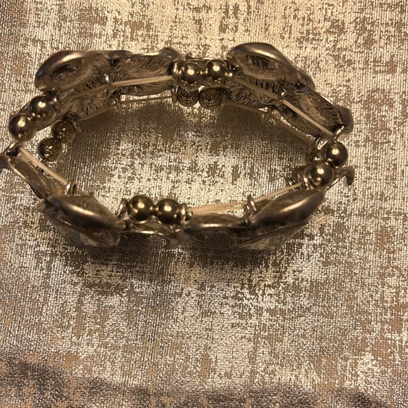 Silver floral stretchy bracelet with rhinestones in the middle of the flower - Picture 2 of 2